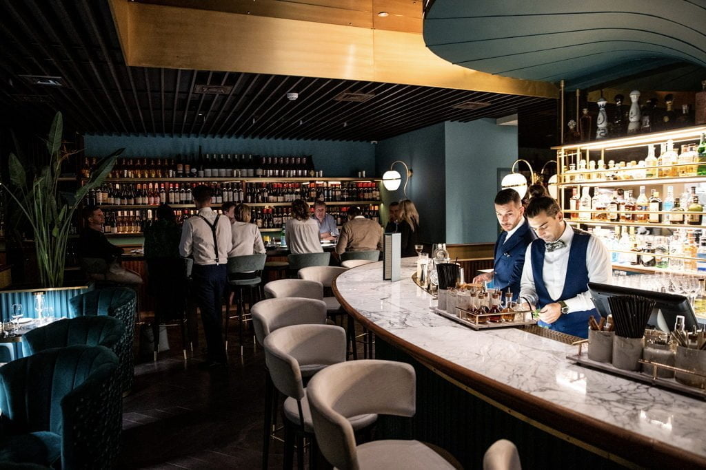 Tables are shared, kitchens become a stage for performing chefs, and especially after lockdown, spaces are opening up, inviting customers into the mix, so they don't feel alone anymore.