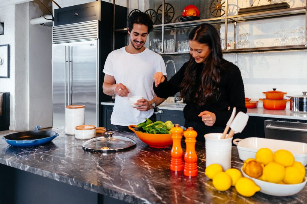 man and woman cooking together kelp salad 