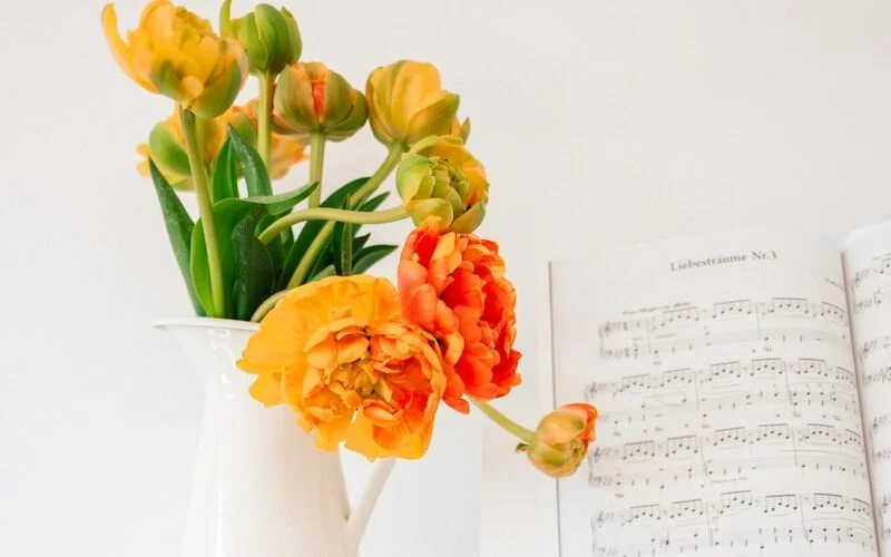 white book page with red and yellow flowers