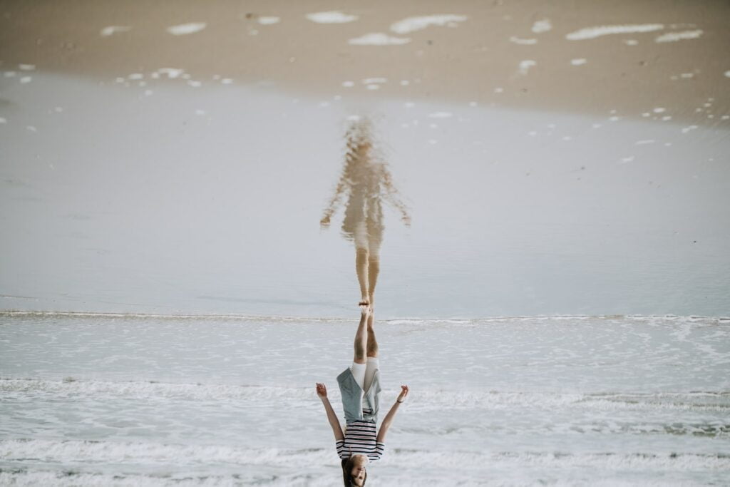 woman walking on beach shore