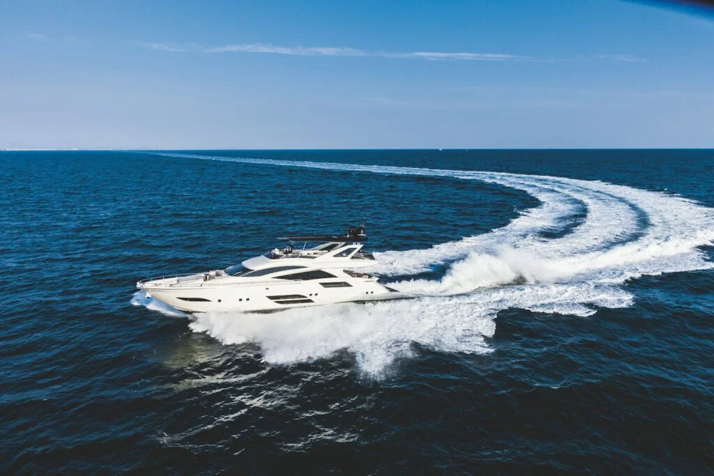 white and black jet plane on sea during daytime
