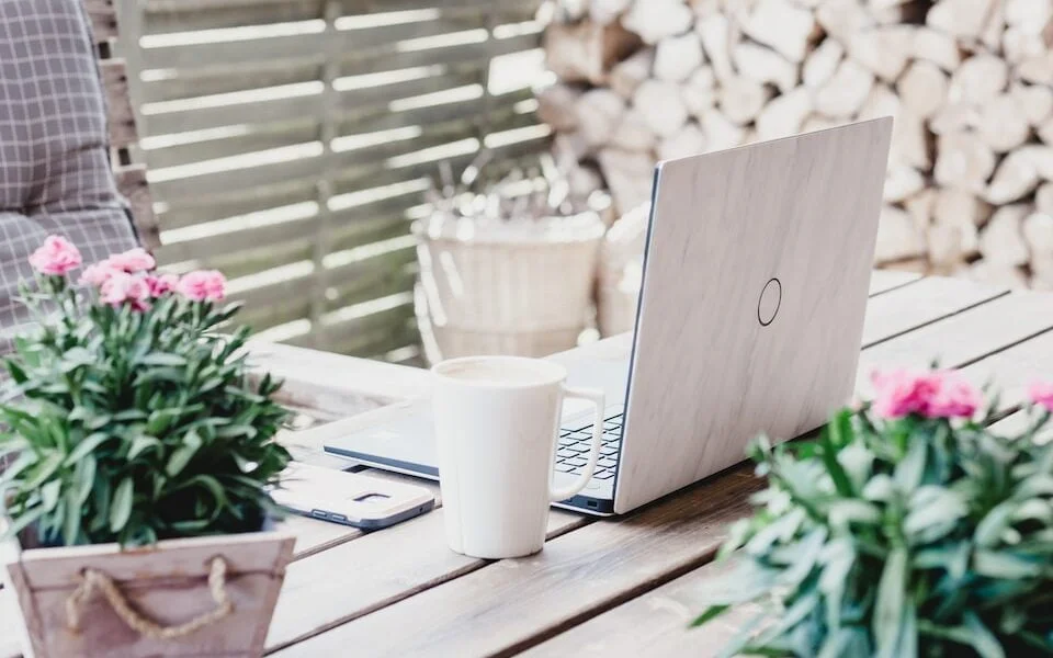 white ceramic mug on wooden surface