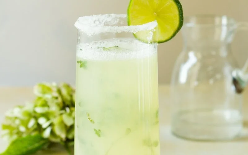lemon juice in clear glass bottle