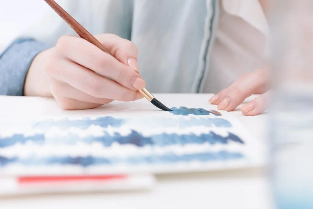 person holding paint brush