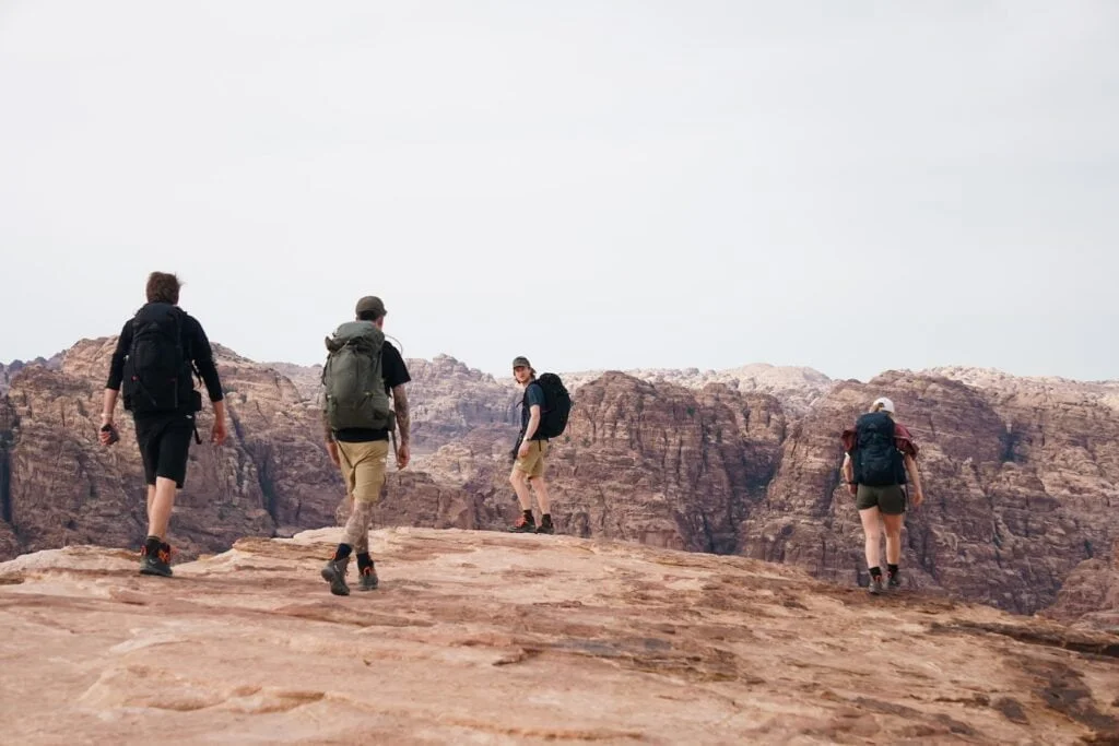 a group of people hiking up a mountain