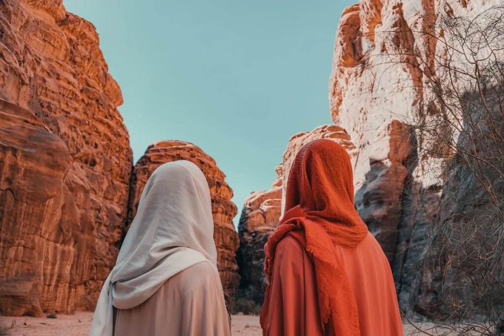 a couple of women standing next to each other