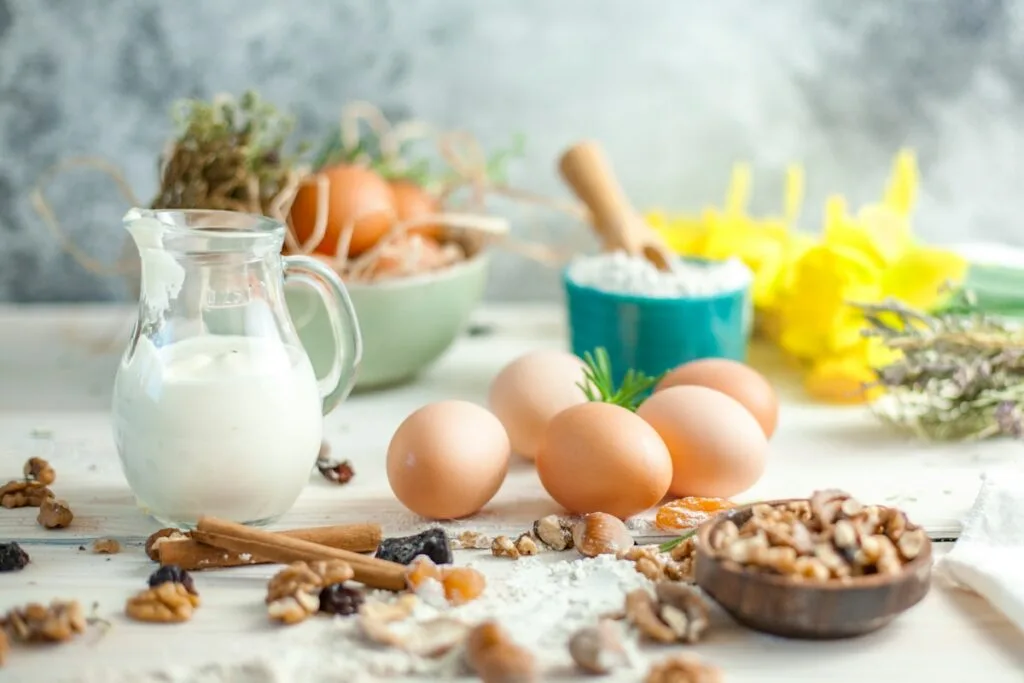 a table with eggs and a glass of milk