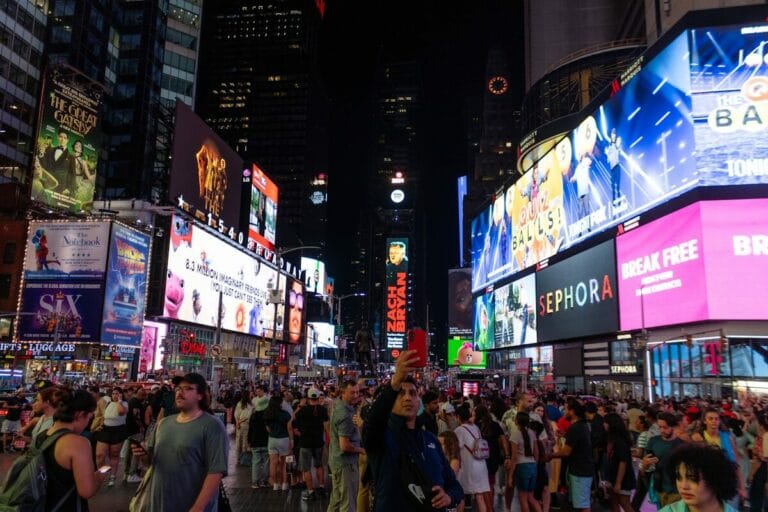 A large group of people standing in the middle of a street