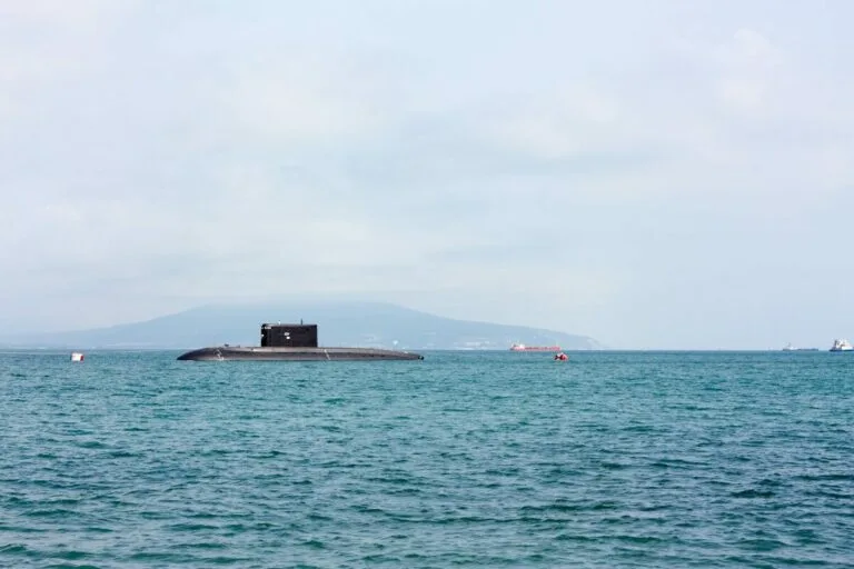 a submarine floating on top of a large body of water