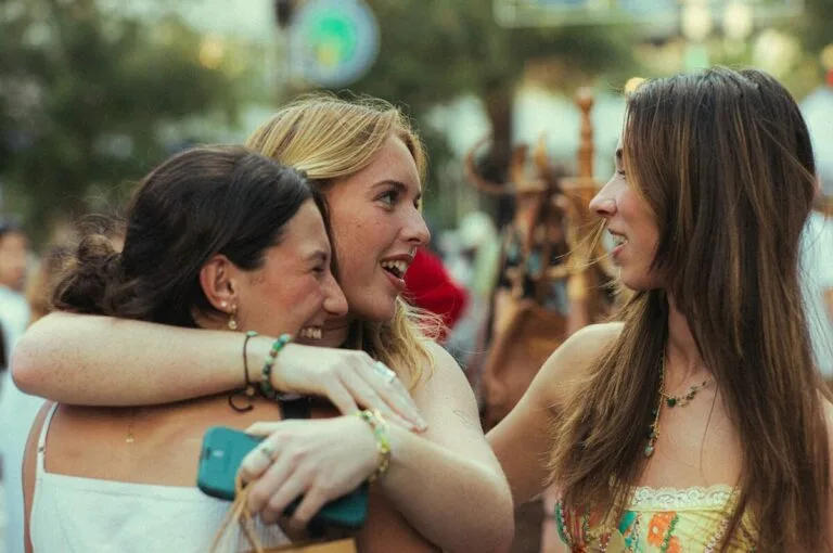 A group of women standing next to each other